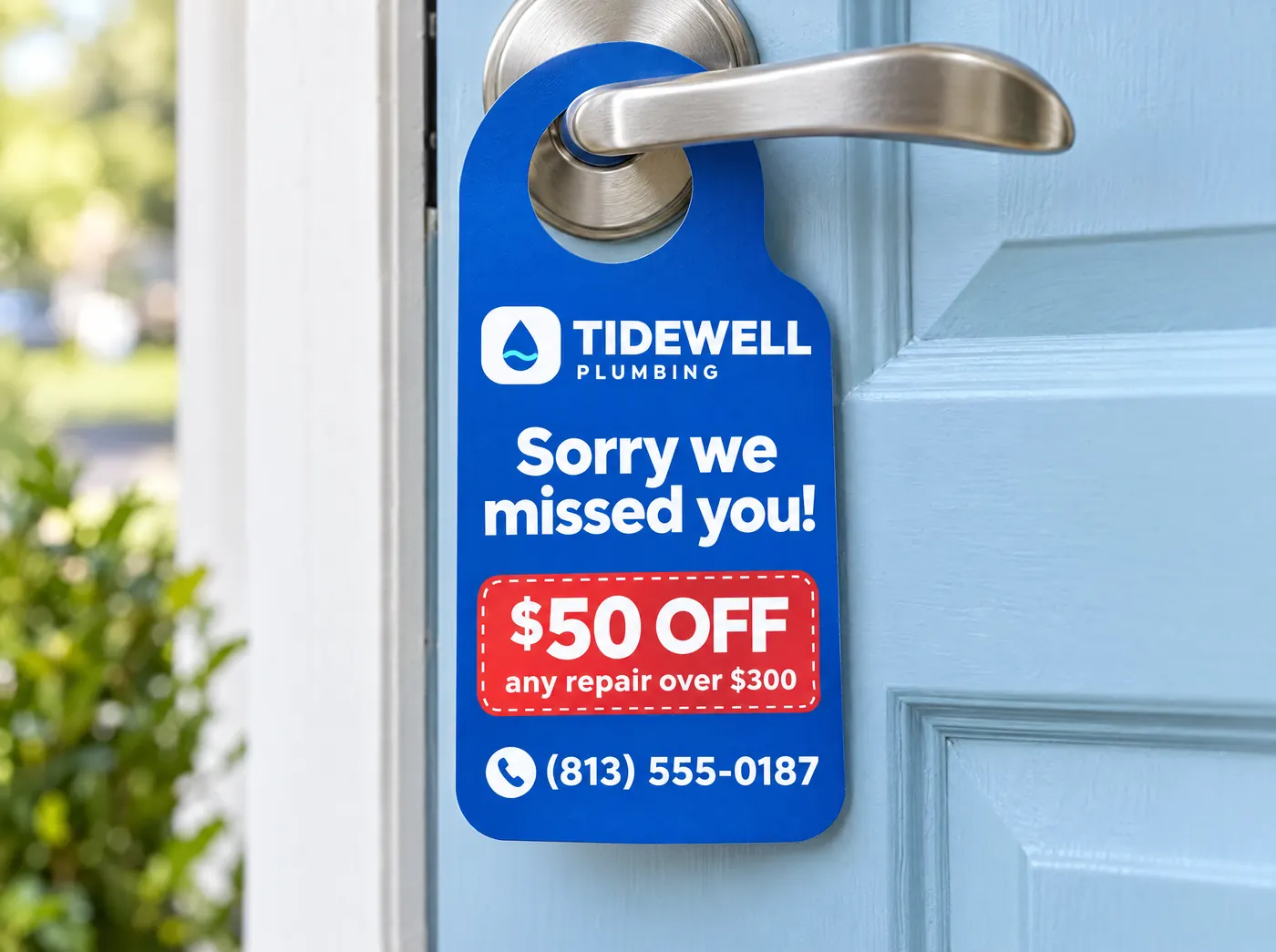 Blue Tidewell door hanger on a front door: sorry we missed you, $50 off