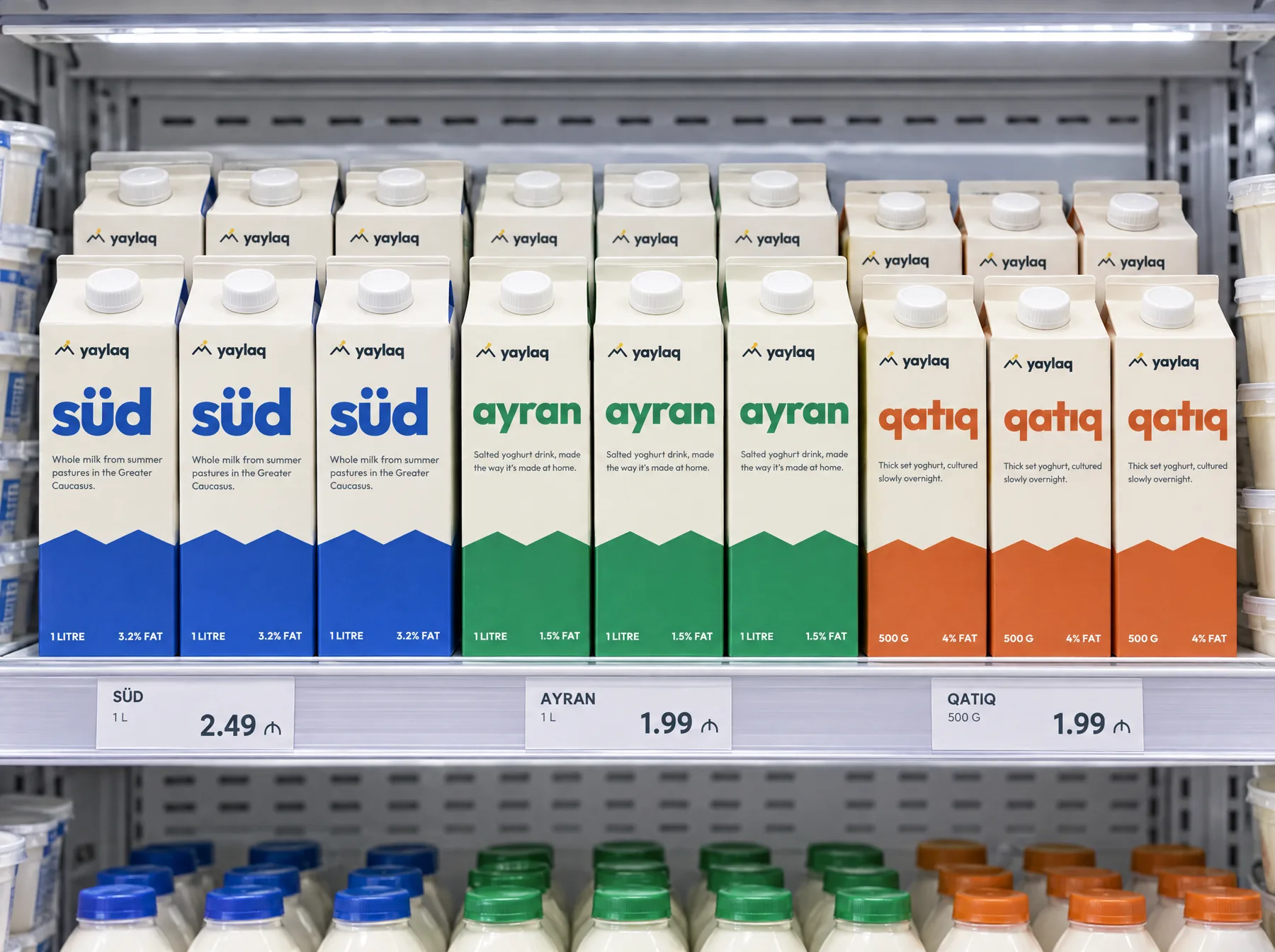 Yaylaq gable-top cartons in blue, green and orange on a supermarket chiller shelf